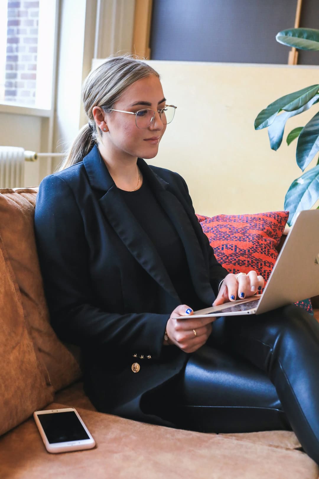 woman wearing a blazer talking about arete hub